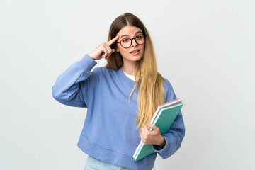 Young blonde student woman isolated on white background thinking an idea