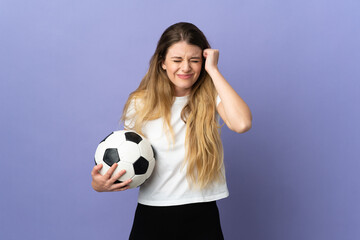 Young blonde football player woman isolated on purple background frustrated and covering ears
