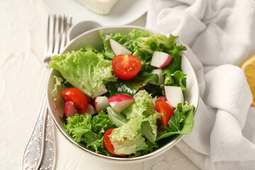 Bowl of healthy salad on light table