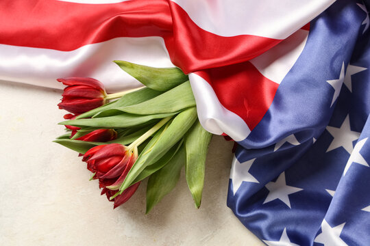 Tulip flowers and flag of USA on light background. Memorial Day celebration - Powered by Adobe