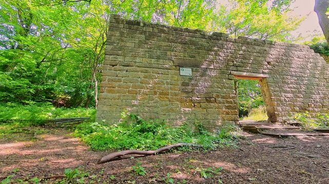 The ruins of the industrial cotton mill on the bank of the Bentley Brook in Lumsdale in the Derbyshire Peak District