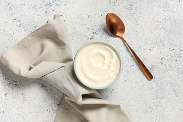 Bowl of tasty yogurt on white background