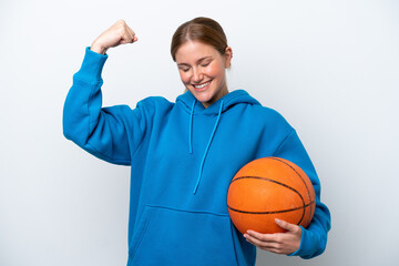 Young caucasian woman playing basketball isolated on white background doing strong gesture