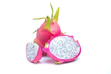 Fresh dragon fruit, arranged on a white background, halved and sliced.