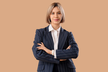 Self-confident, successful businesswoman on beige background