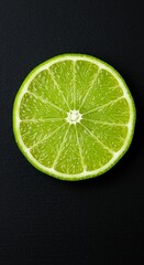 Fresh lime slice isolated on black