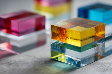 Fototapeta premium stacked transparent geometric blocks with prismatic color effects, clean styling, 