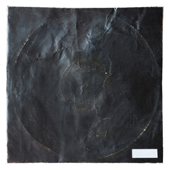 A weathered and damaged black square paper record album cover