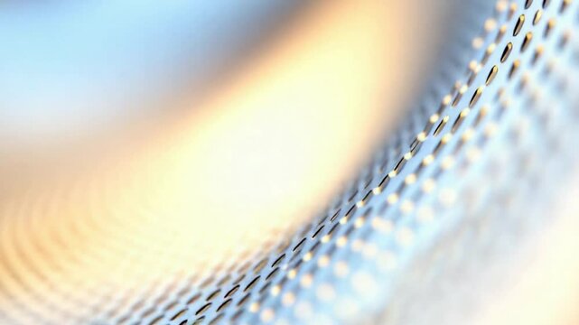 Abstract Metallic Texture with Perforated Surface: A close-up shot of an abstract metallic surface with a perforated pattern creates a mesmerizing visual of light and shadow.