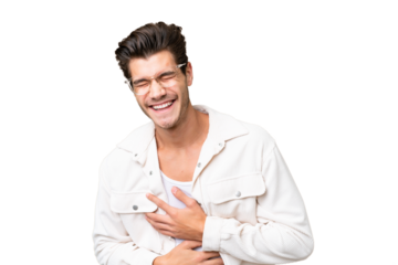 Young handsome caucasian man over isolated background smiling a lot