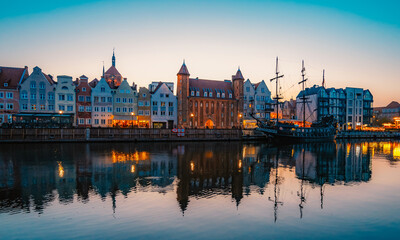 Fototapeta premium Gdansk with Motlawa river in Poland. Old town colourful house with Stragania Gate