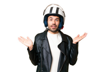 Young caucasian man with a motorcycle helmet over isolated chroma key background with shocked...