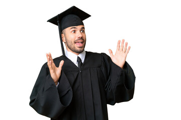 Young university graduate man over isolated chroma key background with surprise facial expression