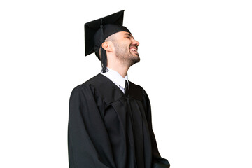 Young university graduate man over isolated chroma key background laughing in lateral position