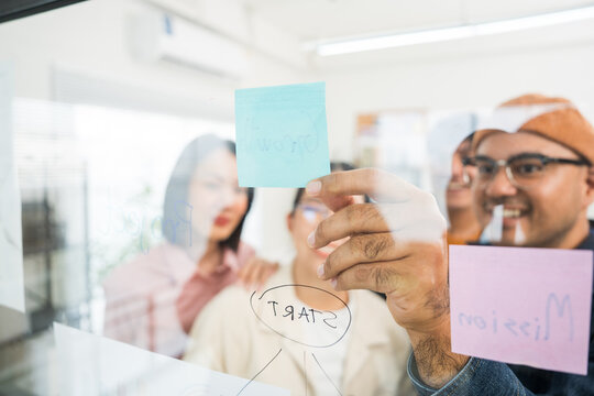 Asian business start up freelance people team analyzing statistics financial. Group Team of businesspeople man and woman Meeting Conference Discussion various topic Corporate Concept in office.