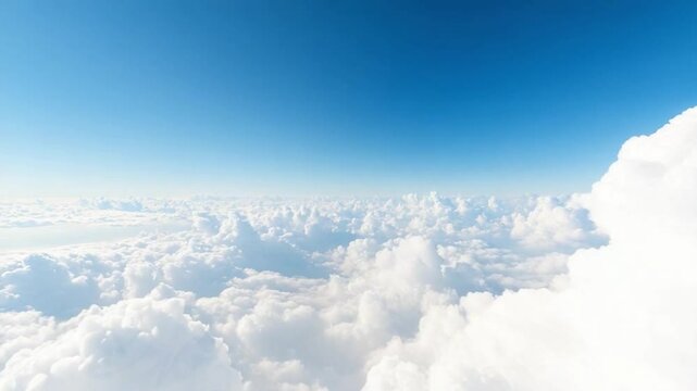 Skyward Serenity: A vast expanse of pristine blue sky merges seamlessly with billowing, fluffy clouds, offering a sense of limitless freedom and tranquility.