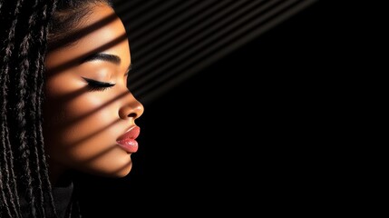 Obraz premium beautiful african woman with braids and black background