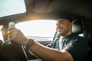 Asian muslim business man getting new car. Happy and excited. Smiling man islamic driving vehicle...
