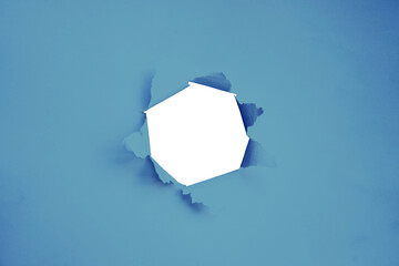 hole in blue paper