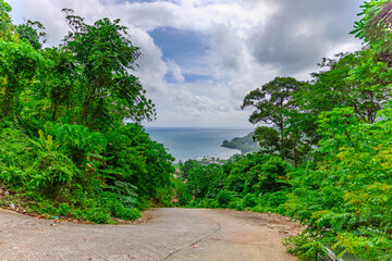 View from Kalim Mountains of Patong Beach in the island of Phuket Thailand, turquoise blue waters of the Andaman and lush green mountains