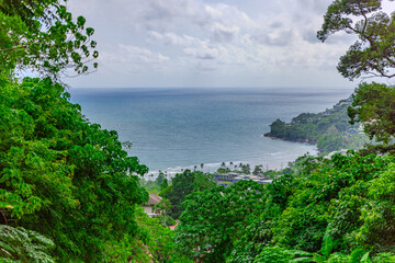 View from Kalim Mountains of Patong Beach in the island of Phuket Thailand, turquoise blue waters of the Andaman and lush green mountains