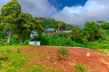 House perched on top of a hill in the mountains of Kalim overlooking the Andaman sea and Patong Beach on the island of Phuket Thailand