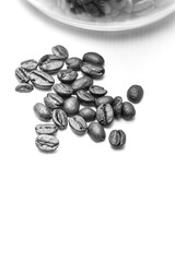 Coffee beans arranged on white background with copyspace