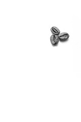 Coffee beans arranged on white background with copyspace