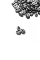 Coffee beans arranged on white background with copyspace