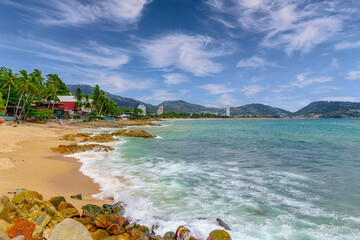 View of Patong Beach in the island of Phuket Thailand, turquoise blue waters of the Andaman and lush green mountains