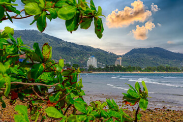 View of Patong Beach in the island of Phuket Thailand, turquoise blue waters of the Andaman and lush green mountains