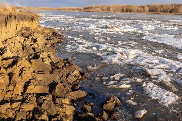 spring landscape, broken ice goes along the river. ice drift along the river
