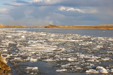 spring landscape, broken ice goes along the river. ice drift along the river
