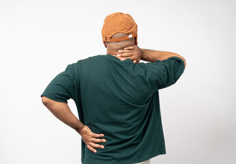 Young asian man has problem with structural posture He had neck and shoulder pain Massaged his neck and shoulders for relief. reduce muscle tension. Standing on isolated white background