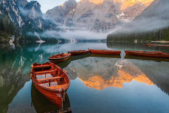 Lago di Braies or Pragser Wildsee lake with boats and fishing dock.Fanes-Sennes-Braies national park in Dolomiti Alps, South Tyrol, Italy