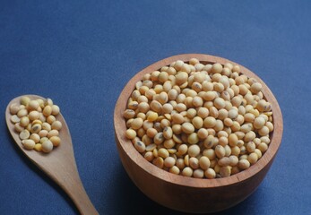 soybeans in a bowl and wooden spoon