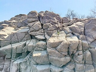 Interested gaze of an extreme sports enthusiast on the dangerous boulders of the Khortytsia coastal cliffs in anticipation of overcoming them.