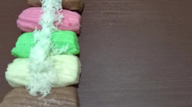 Colorful getuk with grated coconut topping.
 Gethuk is Indonesian Javanese snack made from cassava. 