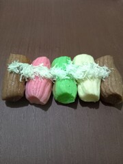 Colorful getuk with grated coconut topping.
 Gethuk is Indonesian Javanese snack made from cassava. 