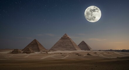 Majestic pyramids stand under a brilliant full moon and starlit sky, casting long shadows across the desert landscape