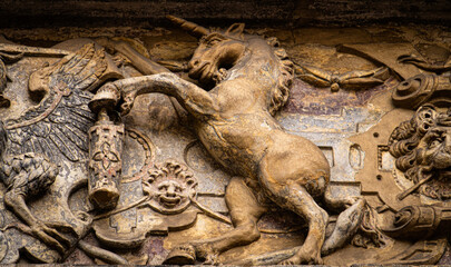 Medieval stone panel with unicorns and royal coat of arms	
