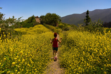 Hiker on flower trail in Tenerife