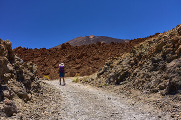 Female hiker on volcanic trail