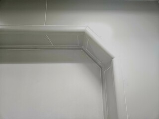 Horizontal molding in clean interior wall, captured with focus on smooth edges, ideal for interior...