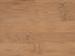 A close up view of a dark bamboo wooden surface