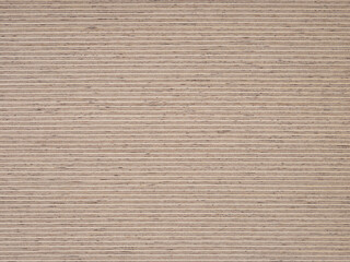 A seamless expanse of textured ash veneer, its rhythmic grains dancing in shades of taupe and ecru