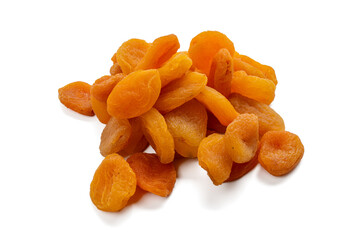Dried apricots lie loosely stacked on a transparent background. The surface appears soft and...