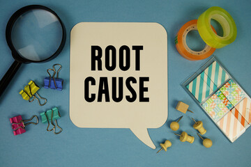 Root Cause text with magnifying glass on blue background