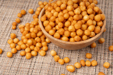 Small pastry balls, fried crispy wheat soup pearls, salad egg puffs or choux pastry