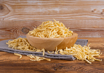 Passatelli spatzle pasta in bowl, raw spaetzle noodles, dry homemade german macaroni